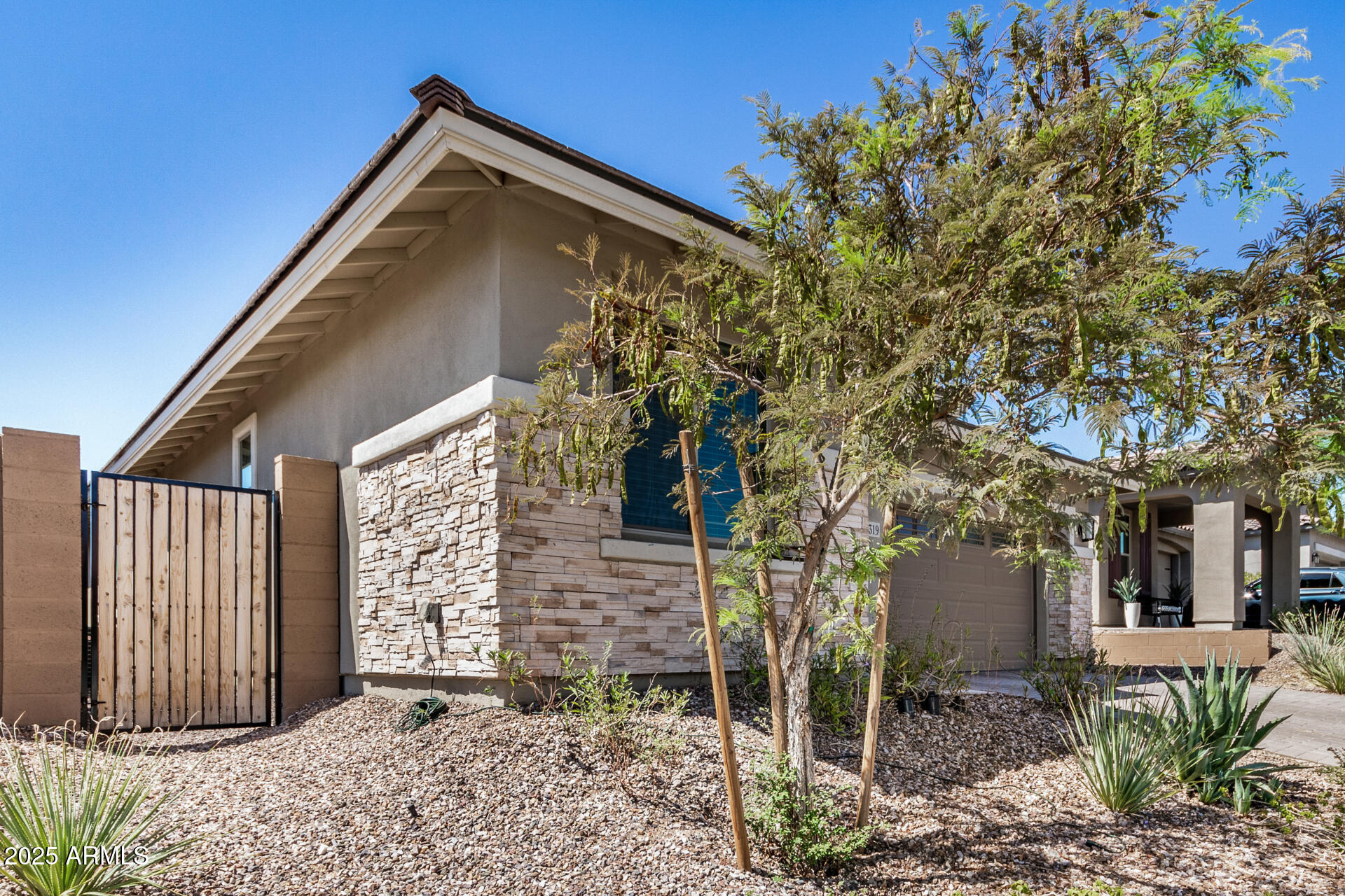 13319 West Red Range Way Peoria, AZ 85383 - Photo 5 of 38 a backyard of a house with table and chairs