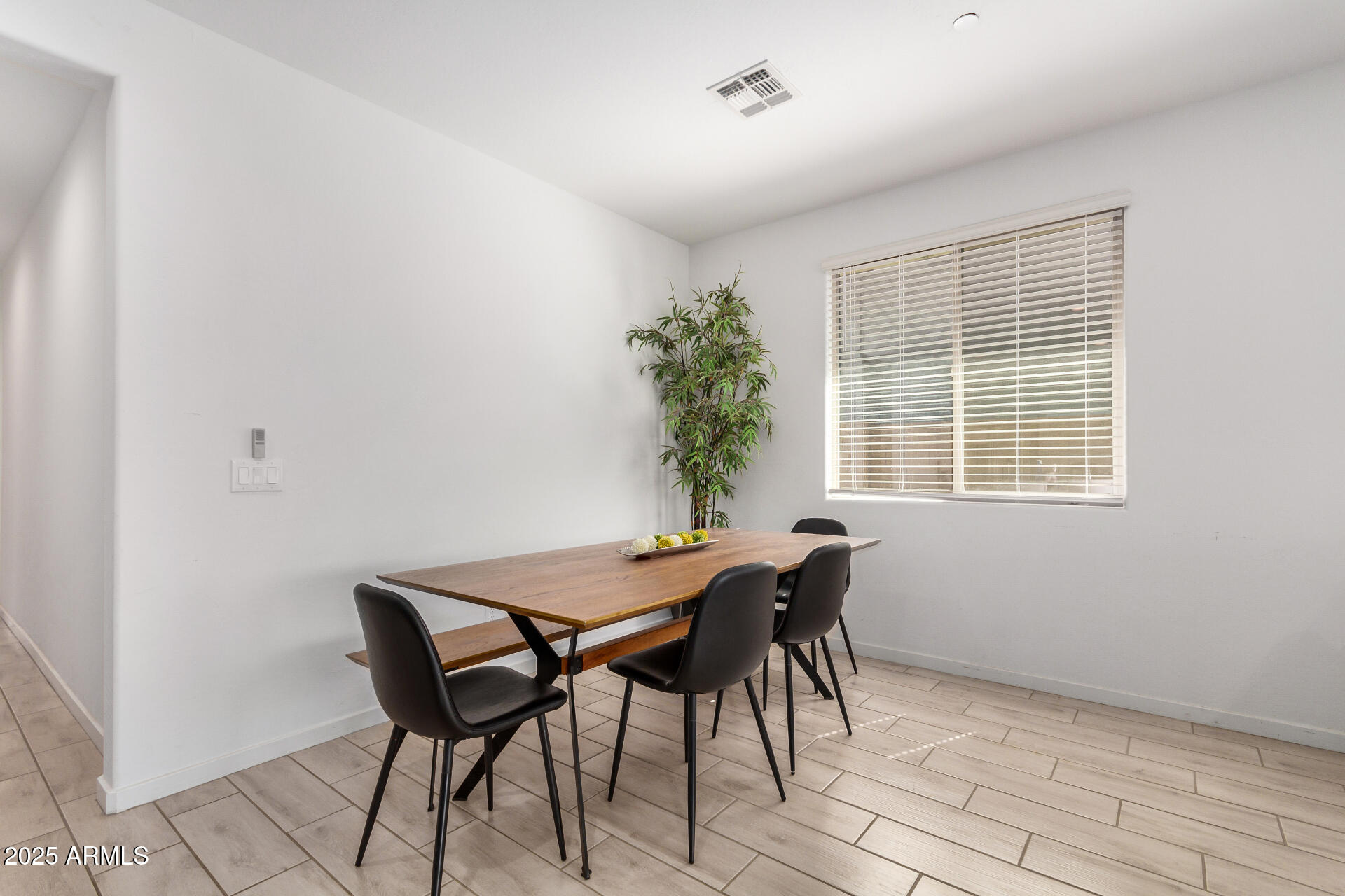 13319 West Red Range Way Peoria, AZ 85383 - Photo 10 of 38 a view of a dining room with furniture and window