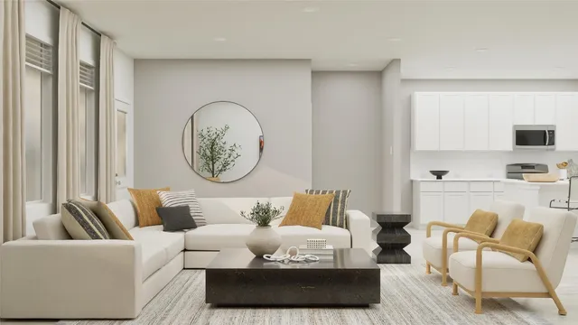 a living room with furniture a rug and a window