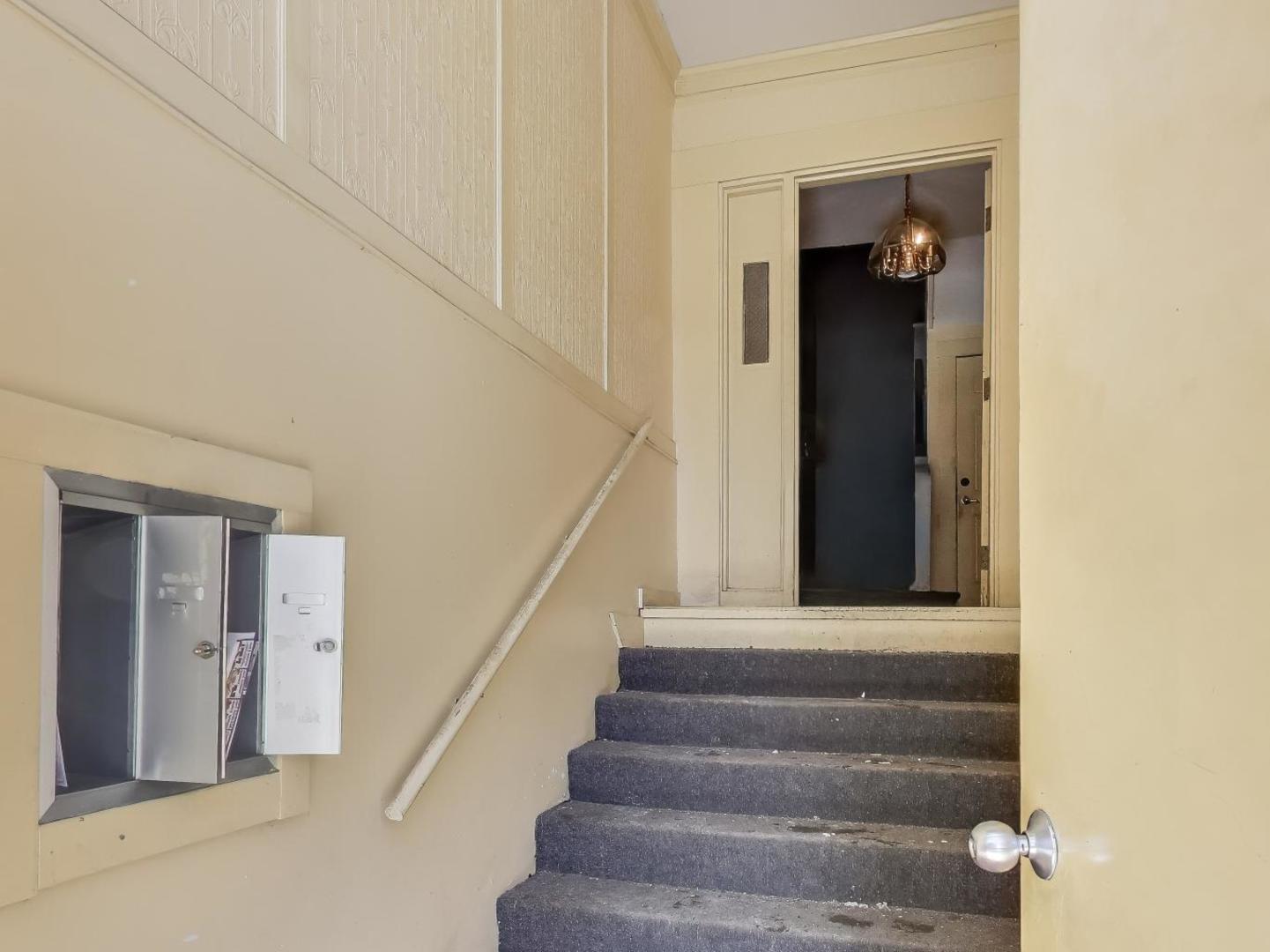 5000 South Champlain Avenue, Unit 3 Chicago, IL 60615 - Photo 2 of 17 a view of staircase with white walls and a window