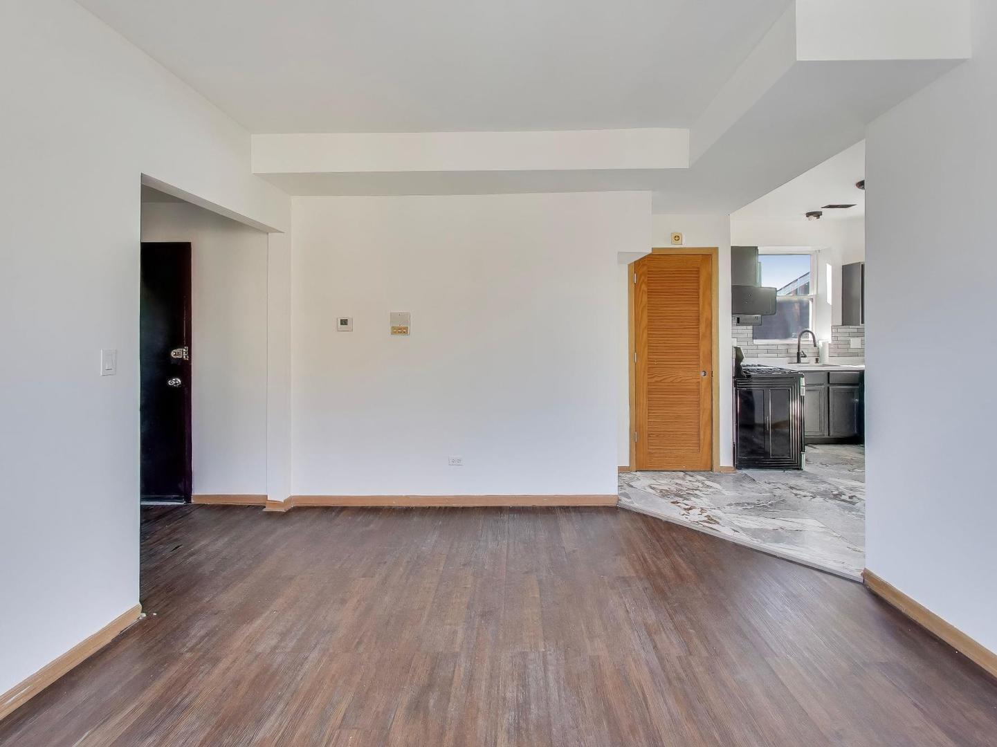 5000 South Champlain Avenue, Unit 3 Chicago, IL 60615 - Photo 4 of 17 a view of empty room with wooden floor