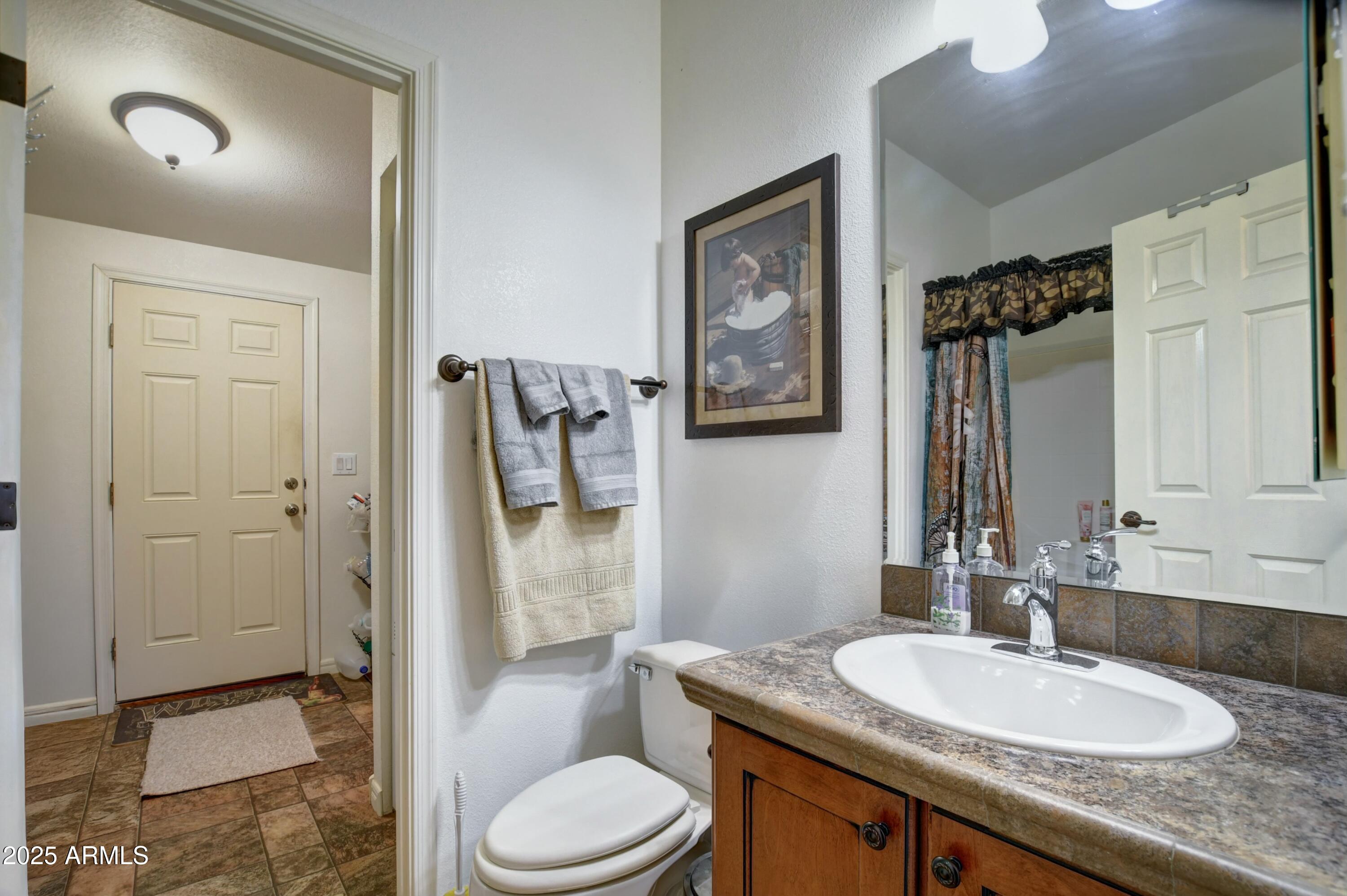 10777 West Raging Crab Road Seligman, AZ 86337 - Photo 17 of 45 Bathroom 2 access to laundry room
