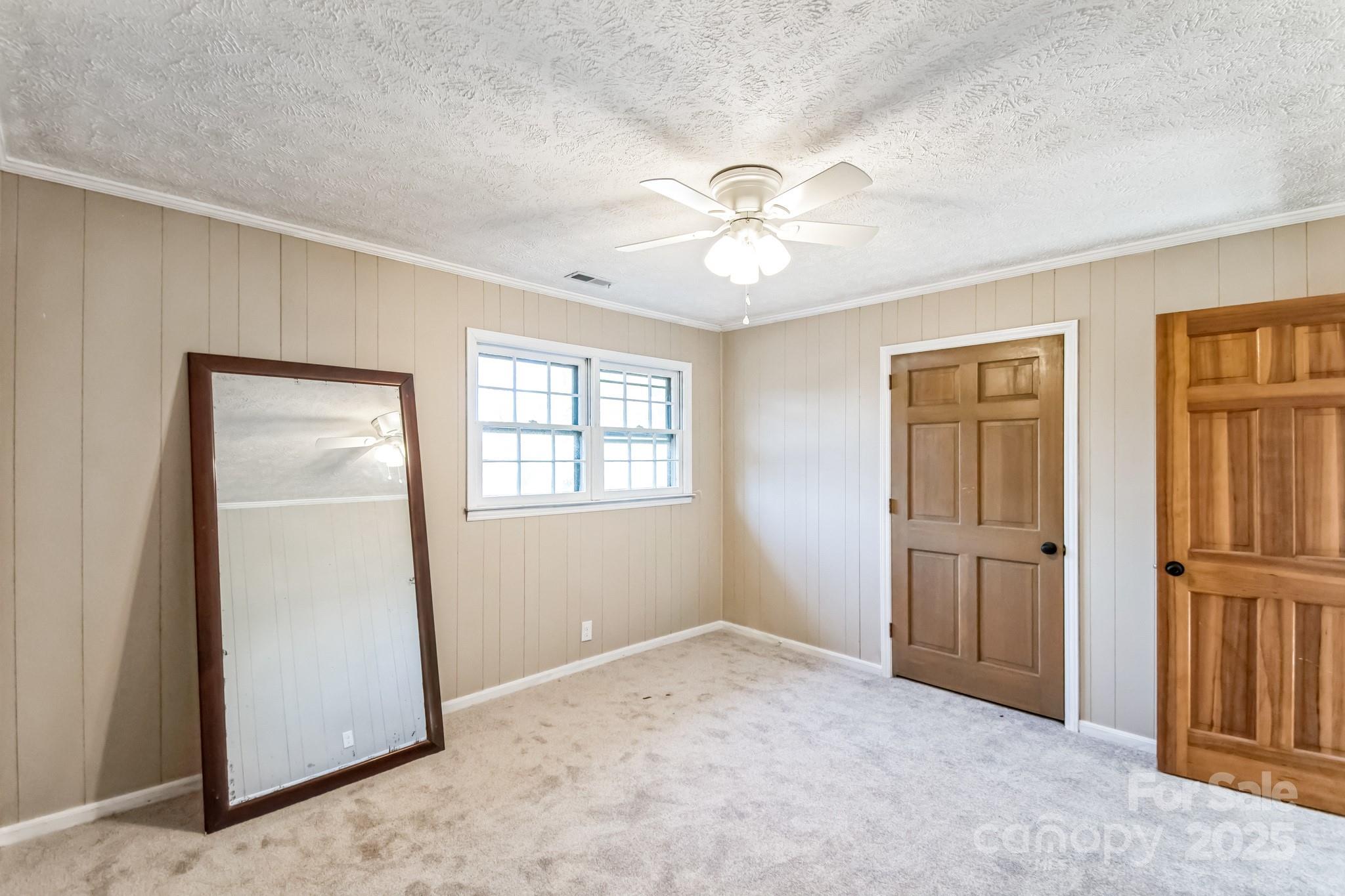 407 Covington Street Rockingham, NC 28379 - Photo 14 of 31 wooden floor in an empty room with a window