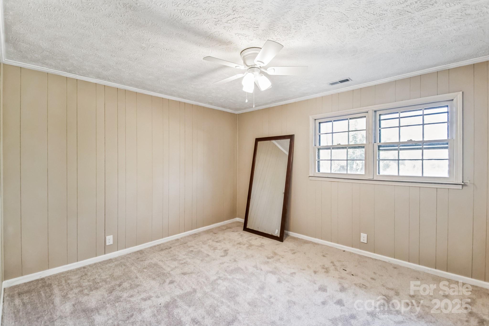 407 Covington Street Rockingham, NC 28379 - Photo 15 of 31 wooden floor in an empty room with a window