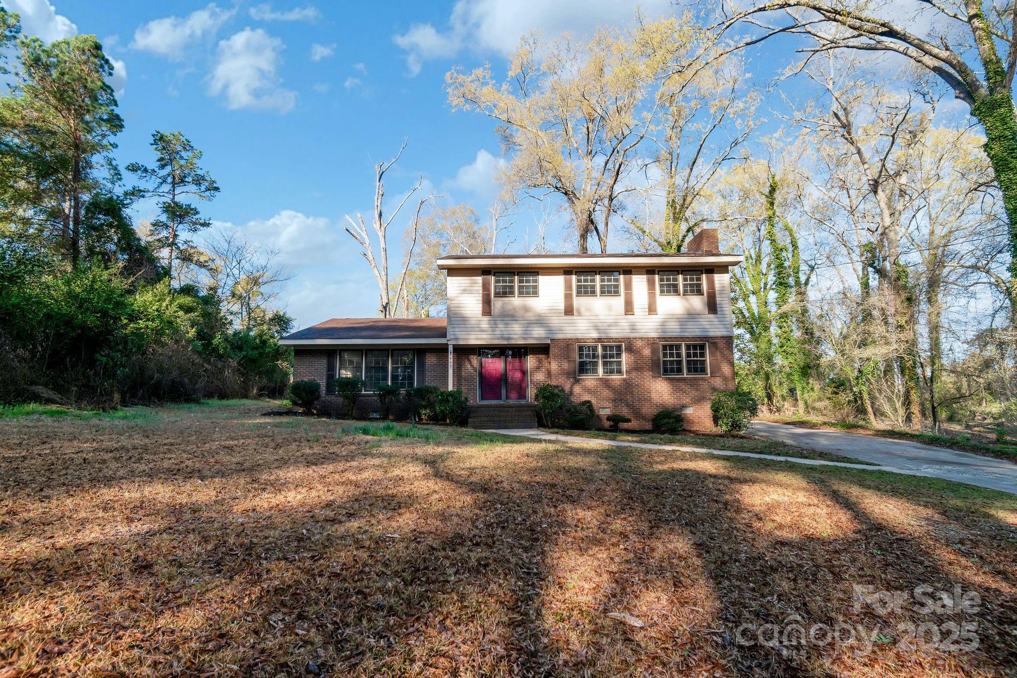 407 Covington Street Rockingham, NC 28379 - Photo 26 of 31 a view of a house with backyard and sitting area