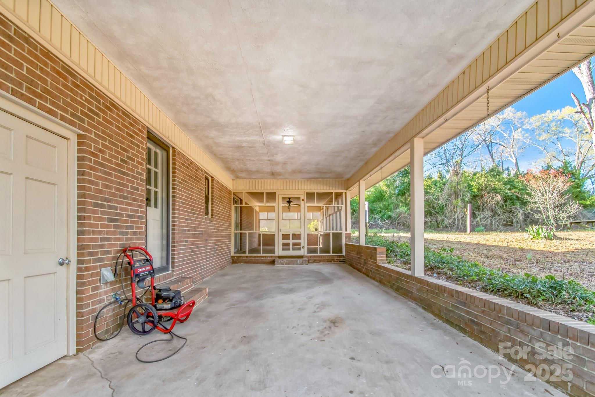 407 Covington Street Rockingham, NC 28379 - Photo 27 of 31 a view of bike storage next to a yard