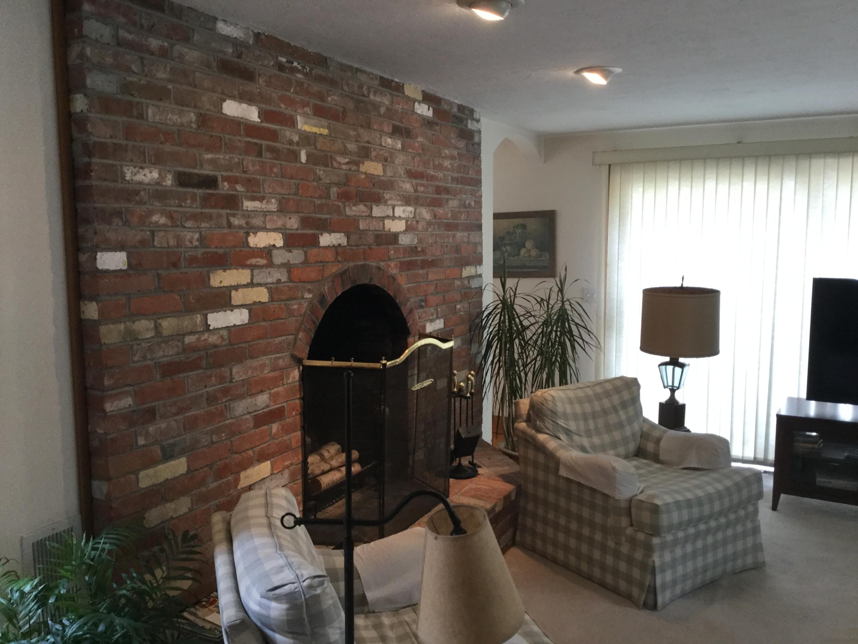 32 Amos Landing Road Mashpee, MA 02649 - Photo 15 of 29 a living room with furniture and a fireplace