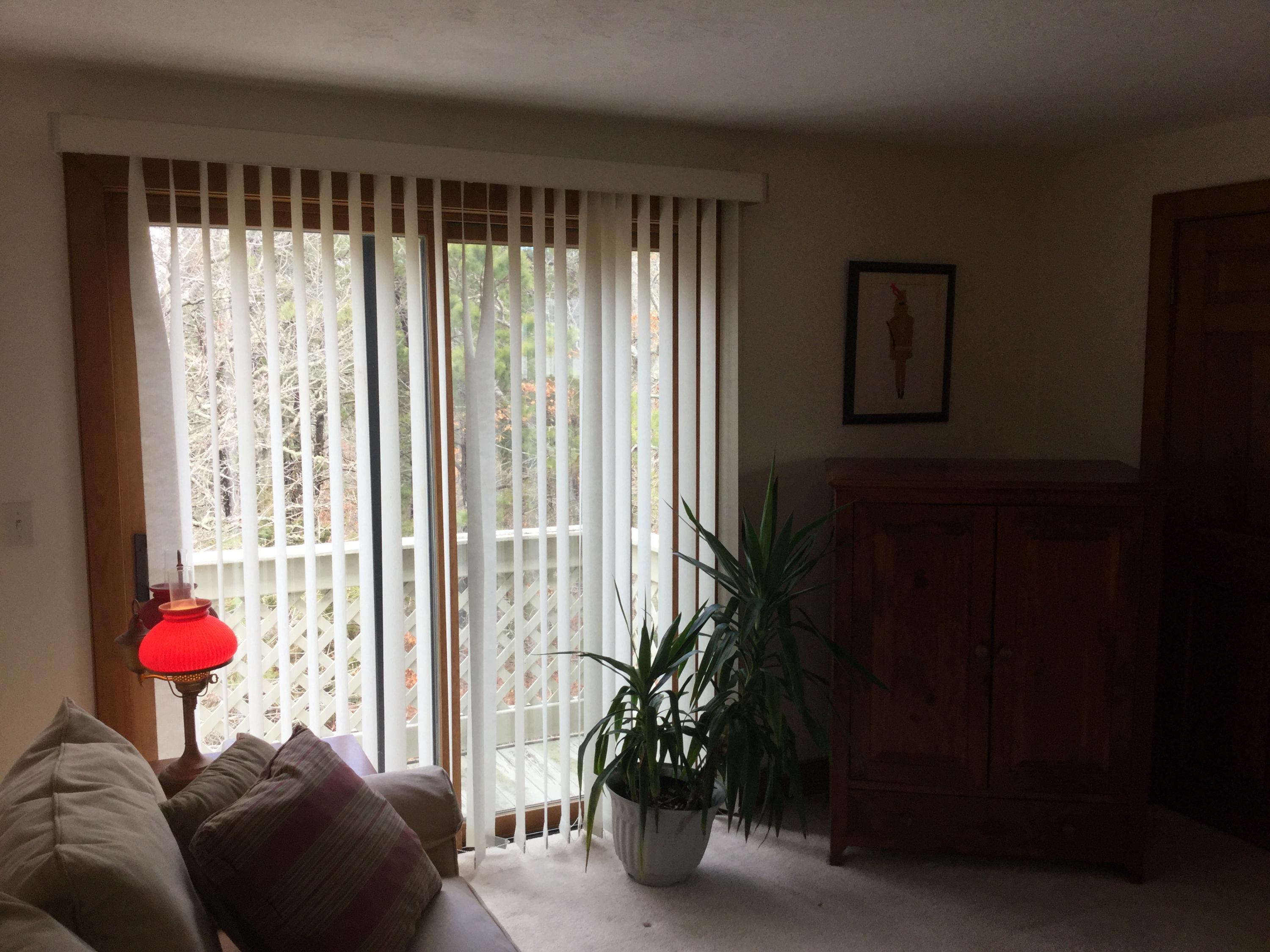 32 Amos Landing Road Mashpee, MA 02649 - Photo 23 of 29 a living room with furniture and a floor to ceiling window