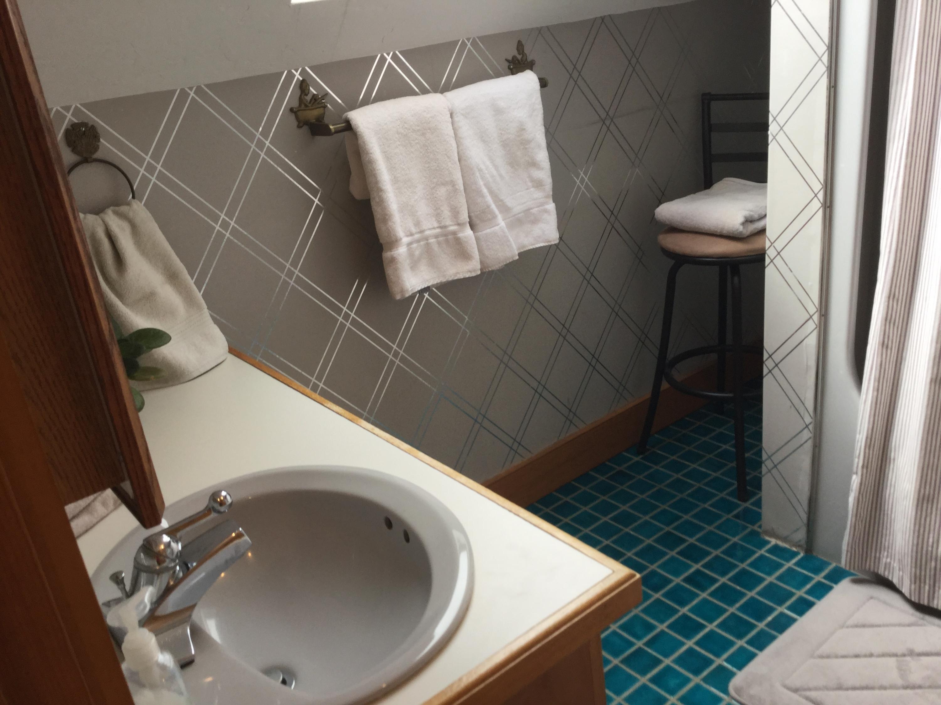 32 Amos Landing Road Mashpee, MA 02649 - Photo 27 of 29 a bathroom with a sink toilet and a mirror