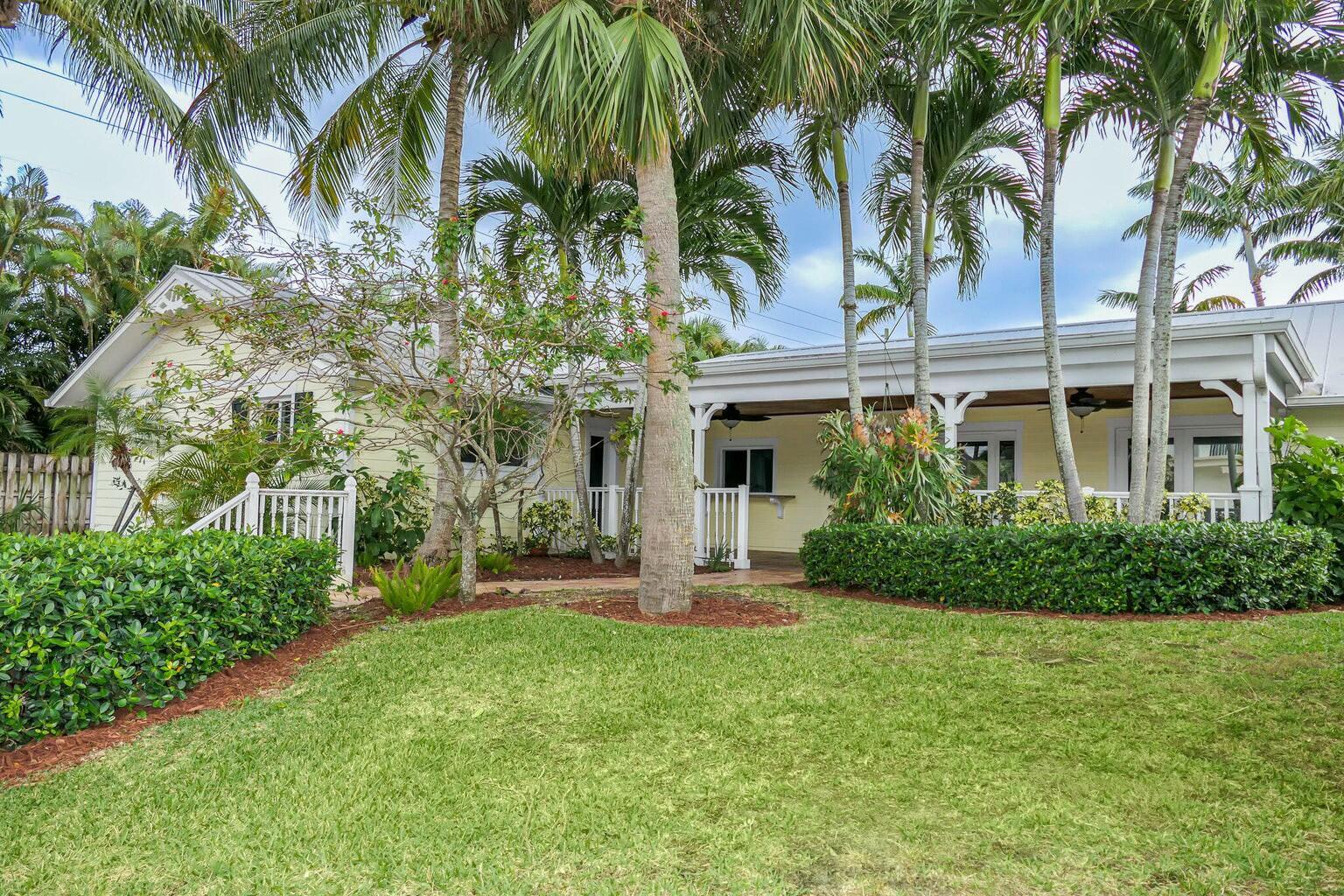 18014 Perigon Way Jupiter, FL 33458 - Photo 27 of 35 a front view of a house with a garden