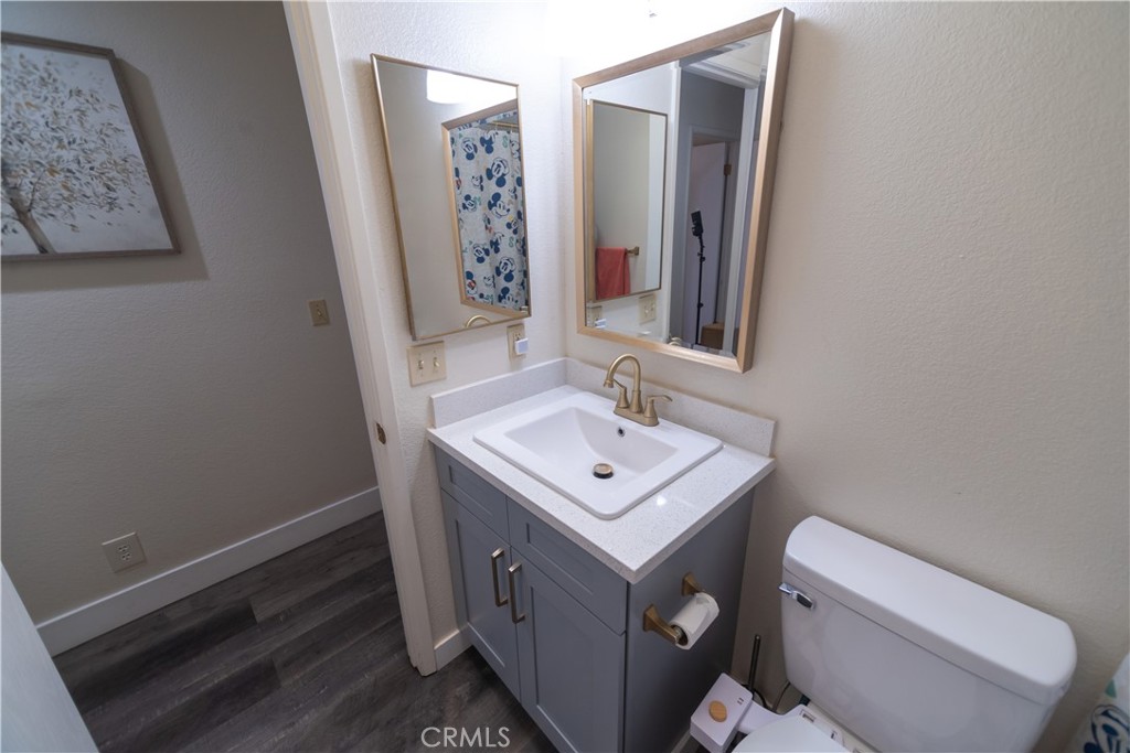 1 San Ramon Drive Chico, CA 95973 - Photo 22 of 42 a bathroom with a sink toilet and mirror