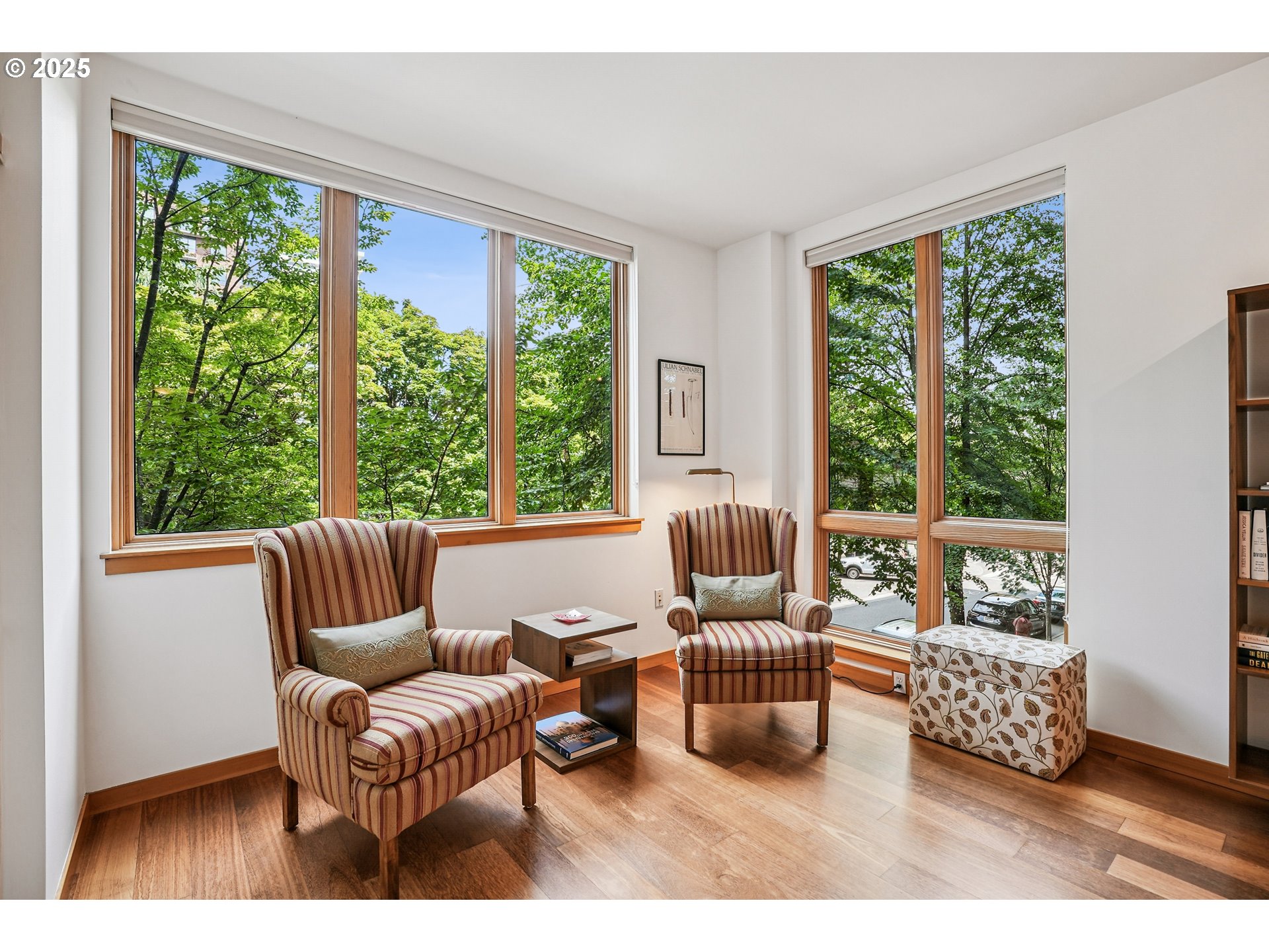 1030 Northwest Johnson Street, Unit 224 Portland, OR 97209 - Photo 12 of 36 a living room with furniture and a large window