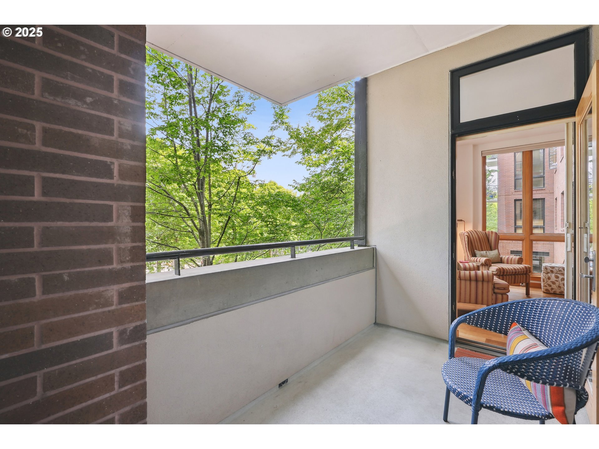 1030 Northwest Johnson Street, Unit 224 Portland, OR 97209 - Photo 13 of 36 a balcony with chairs and a table