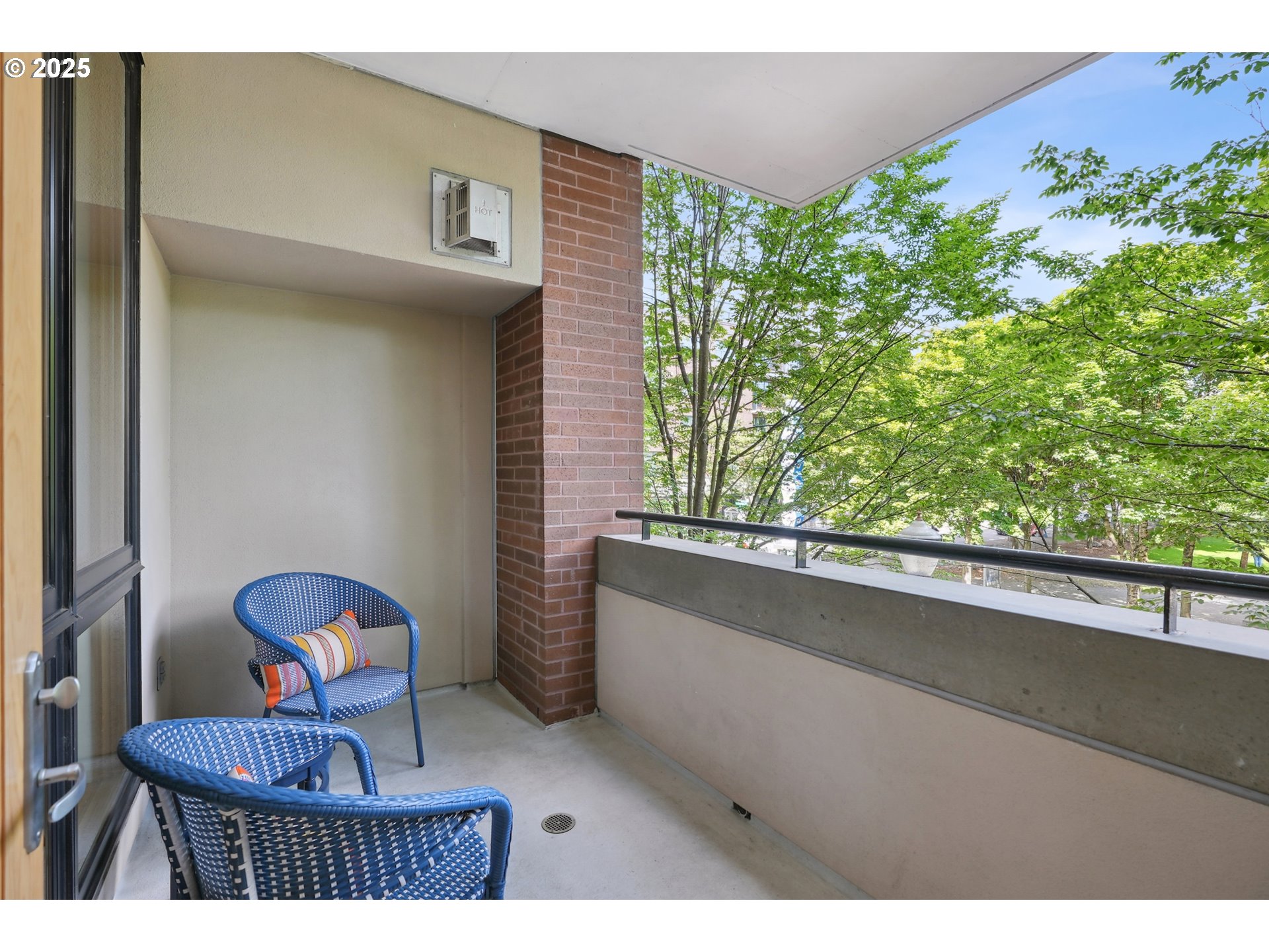 1030 Northwest Johnson Street, Unit 224 Portland, OR 97209 - Photo 14 of 36 a picture of a room with a window and flower plants
