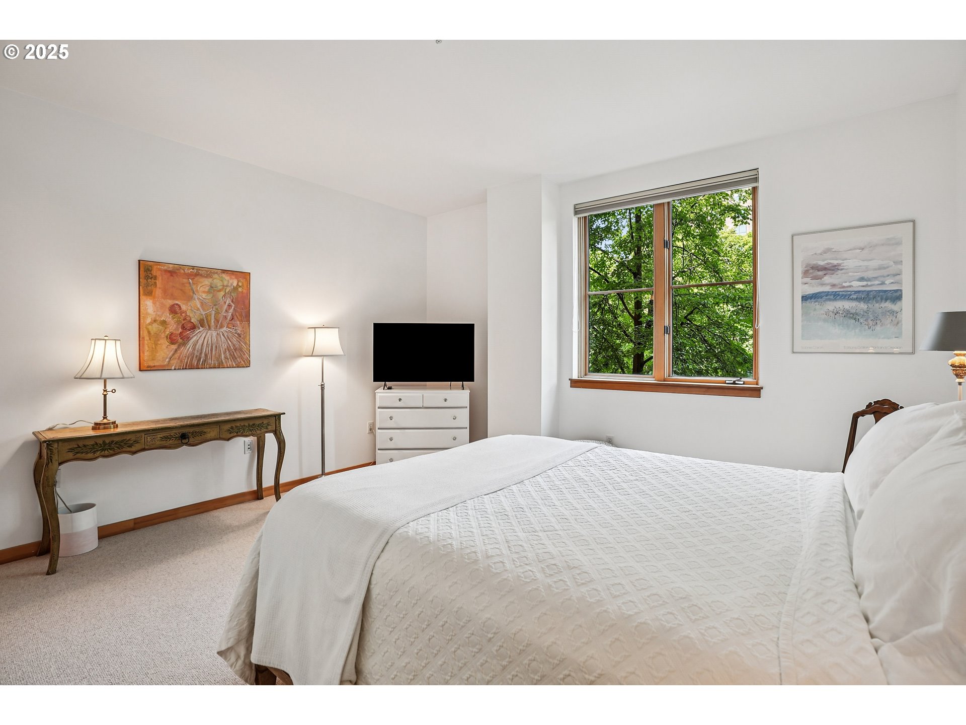 1030 Northwest Johnson Street, Unit 224 Portland, OR 97209 - Photo 18 of 36 a bedroom with a bed and a tv