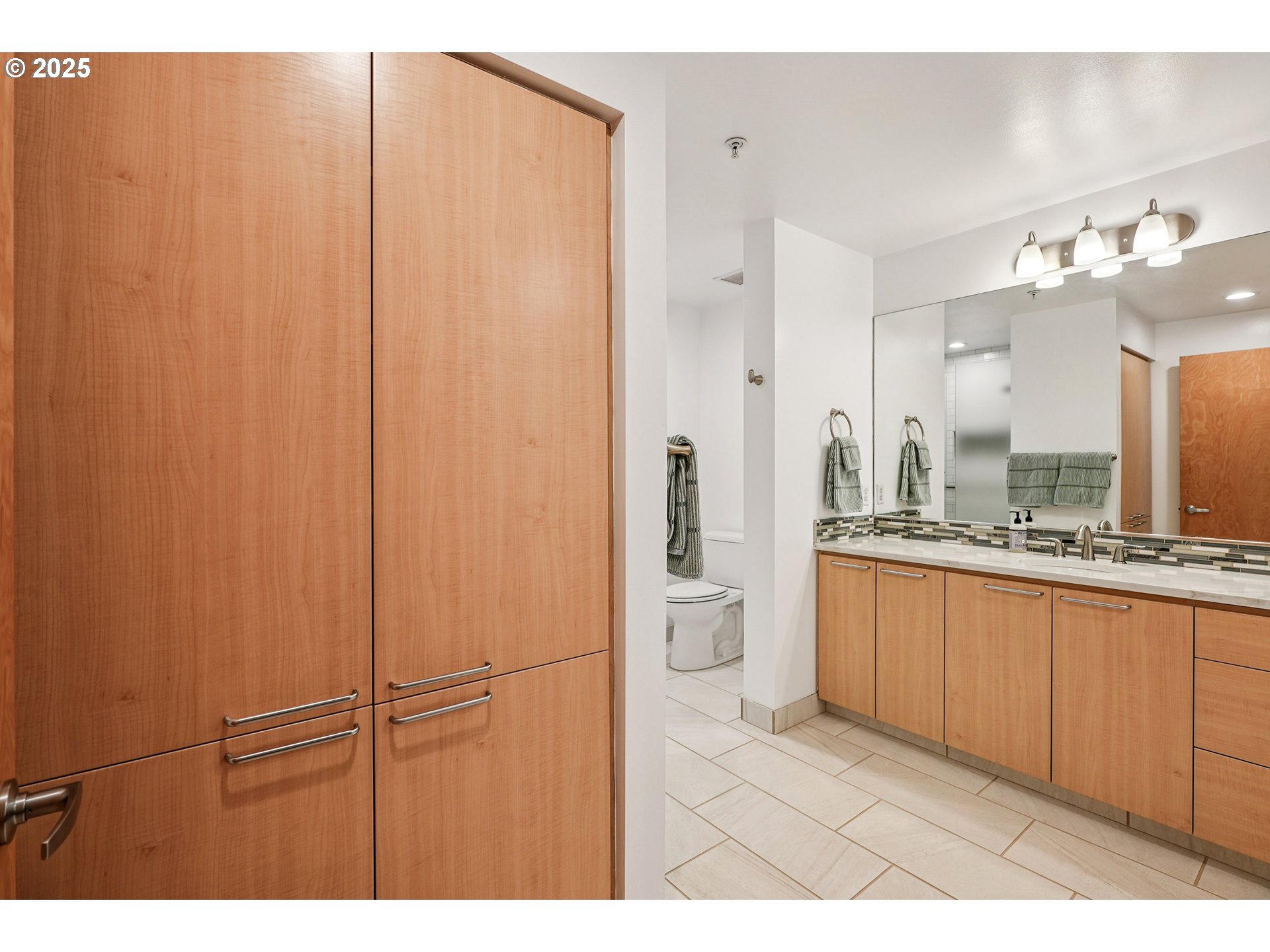1030 Northwest Johnson Street, Unit 224 Portland, OR 97209 - Photo 22 of 36 a bathroom with a sink and a mirror
