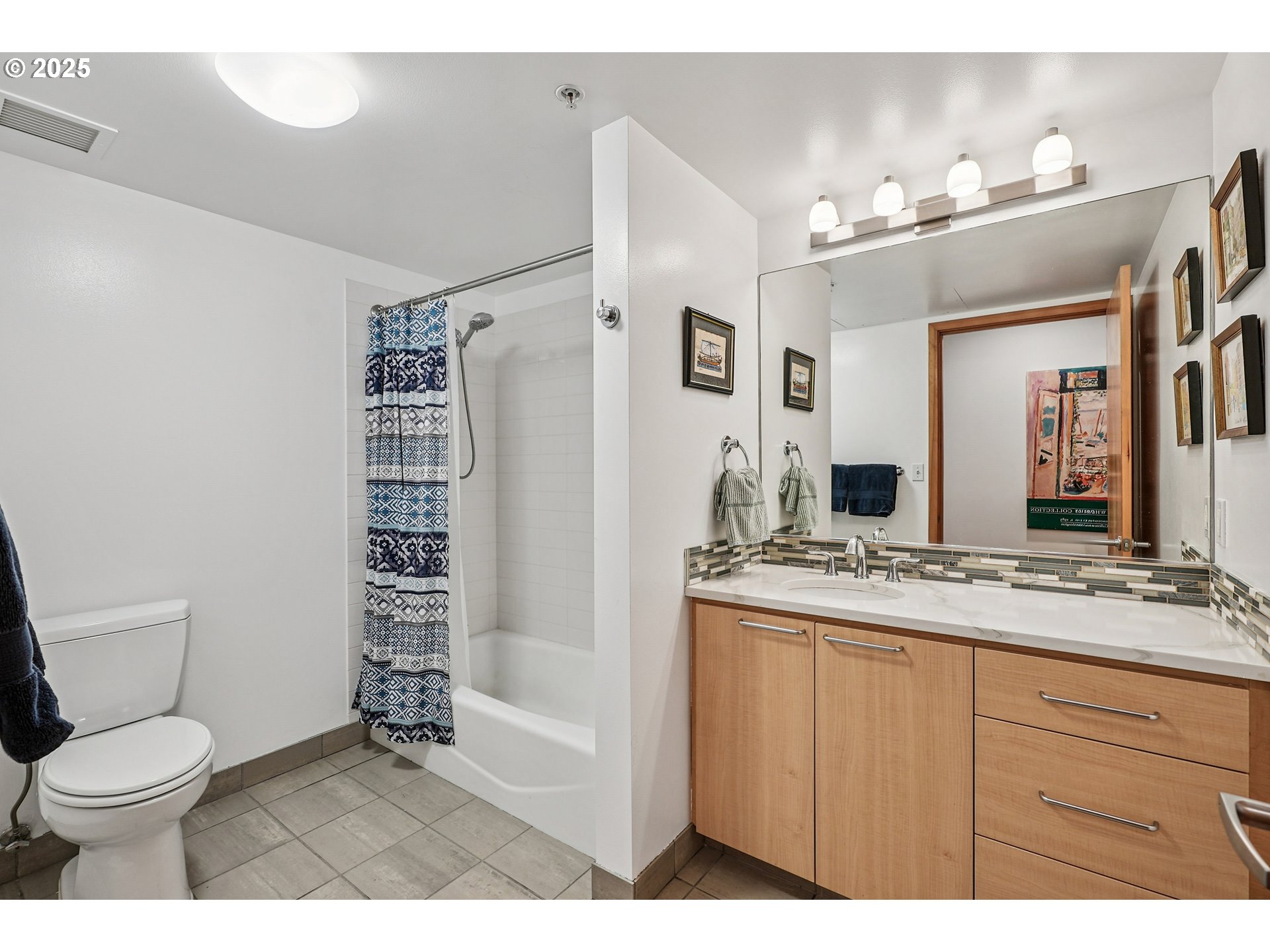 1030 Northwest Johnson Street, Unit 224 Portland, OR 97209 - Photo 25 of 36 a bathroom with a sink a toilet and shower