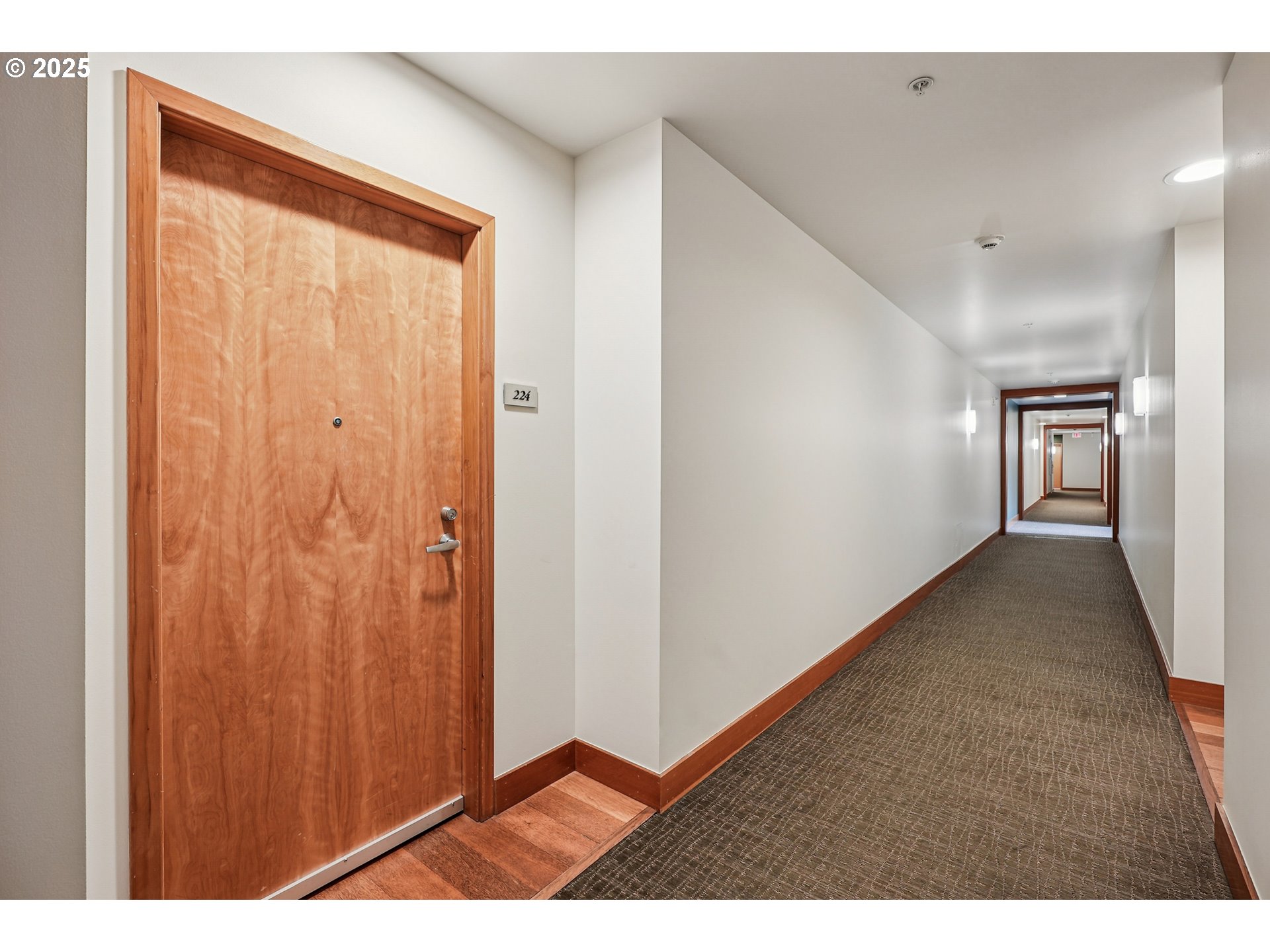 1030 Northwest Johnson Street, Unit 224 Portland, OR 97209 - Photo 29 of 36 a view of a hallway with wooden floor
