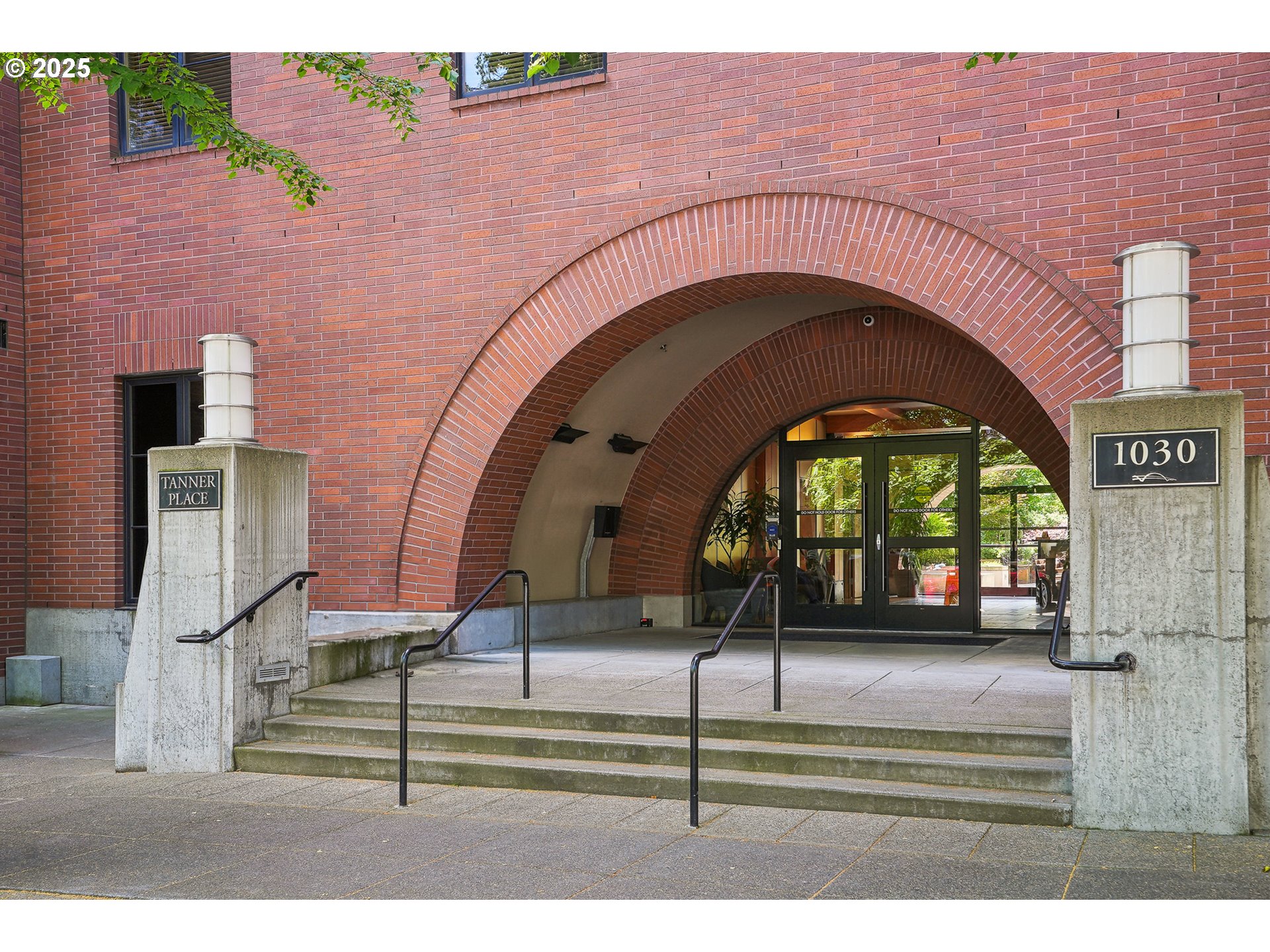 1030 Northwest Johnson Street, Unit 224 Portland, OR 97209 - Photo 36 of 36 a view of entrance gate of a brick building