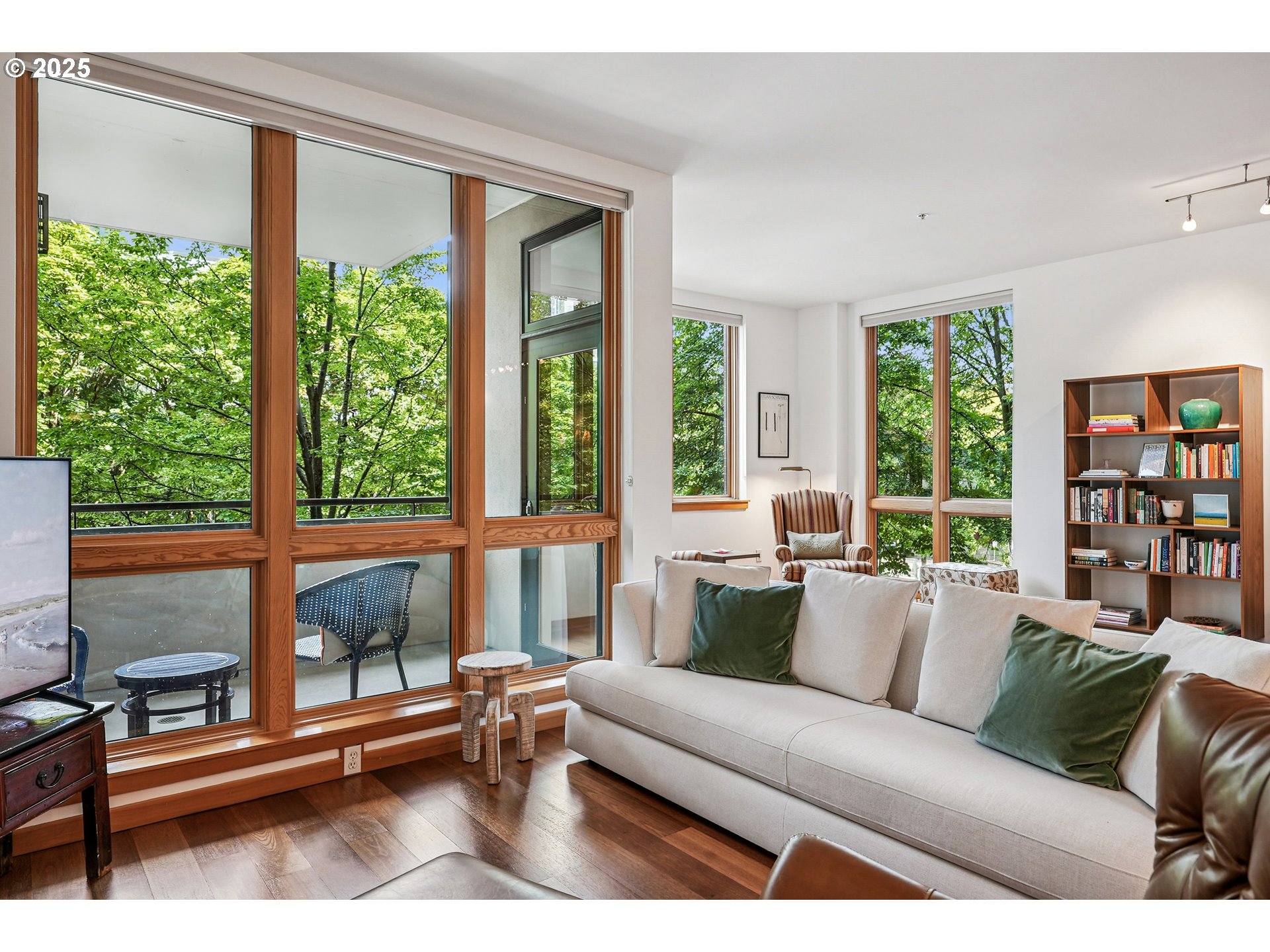 1030 Northwest Johnson Street, Unit 224 Portland, OR 97209 - Photo 5 of 36 a living room with furniture and a large window
