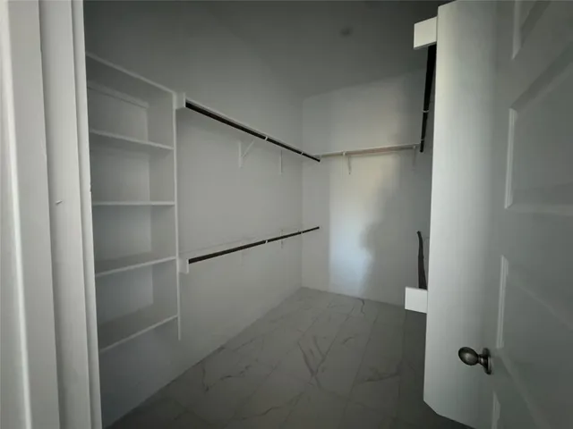 a view of an empty walk in closet