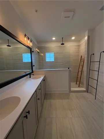 a bathroom with a tub and a shower