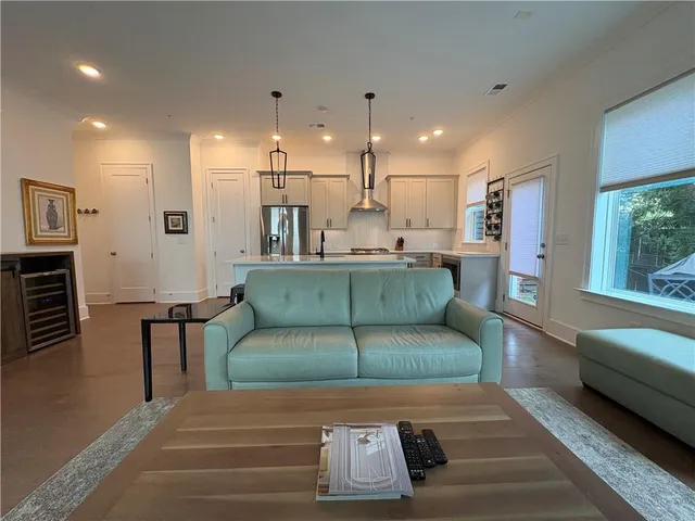 a building outdoor space with patio furniture and potted plants