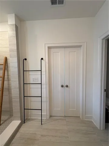 a bathroom with a double vanity sink and mirror