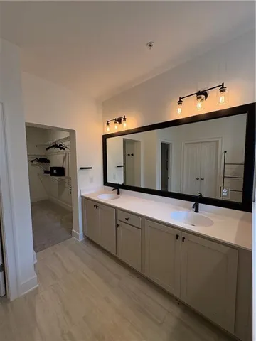 a kitchen with a sink and a refrigerator