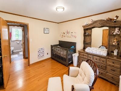 202 Maggart Road Elmwood, TN 38560 - Photo 9 of 34 a bedroom with furniture and wooden floor