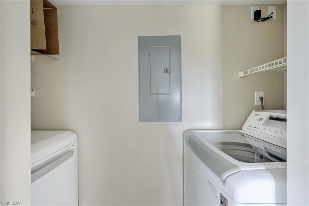 190 Pebble Beach Boulevard, Unit 502 Naples, FL 34113 - Photo 15 of 21 a utility room with dryer and washer