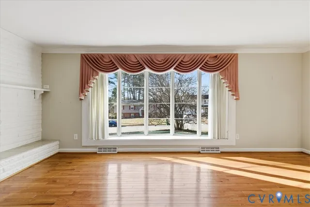 a view of a door and window in an empty room