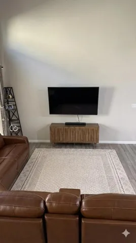 a living room with a couch and a flat screen tv