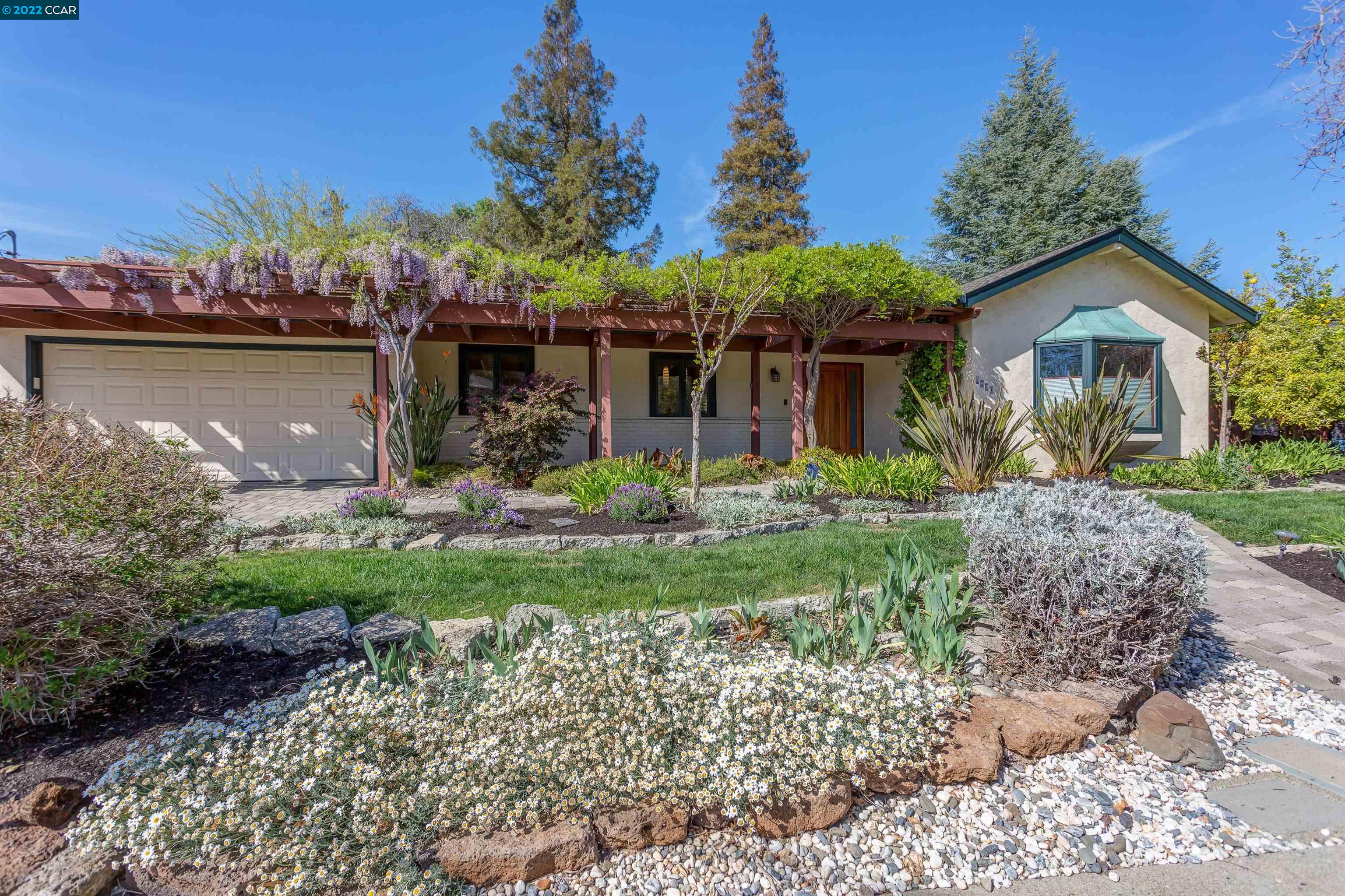 1134 Arkell Road Walnut Creek, CA 94598 - Photo 1 of 1 a front view of a house with garden