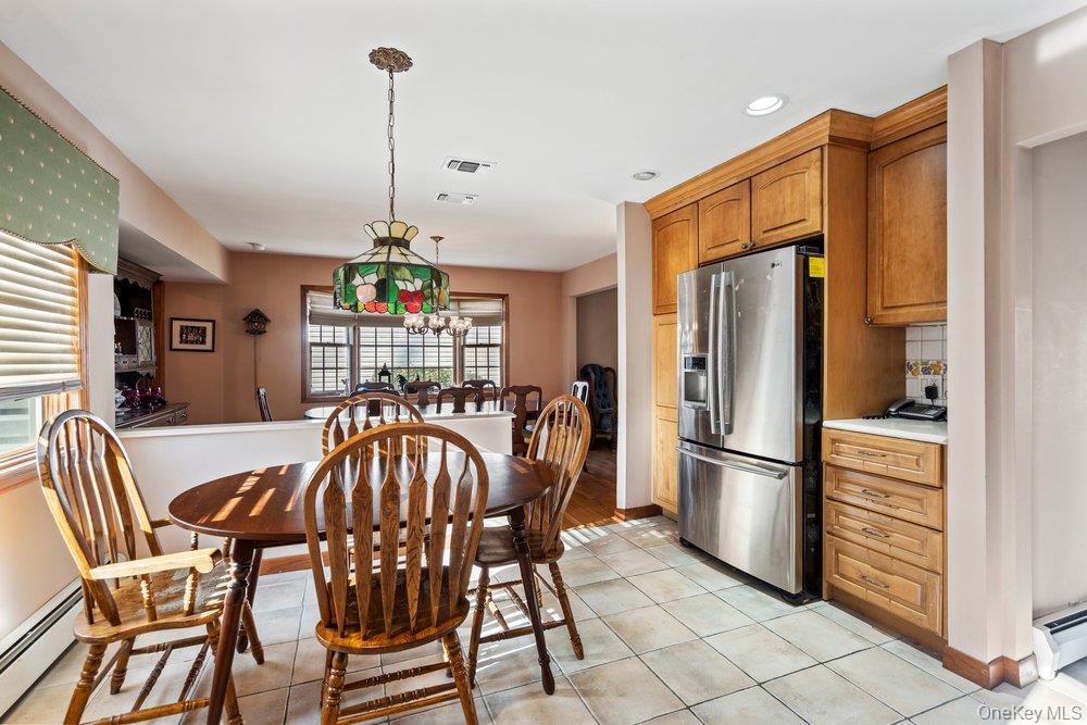 18 Barry Lane Syosset, NY 11791 - Photo 16 of 37 a view of a dining room with furniture window and wooden floor