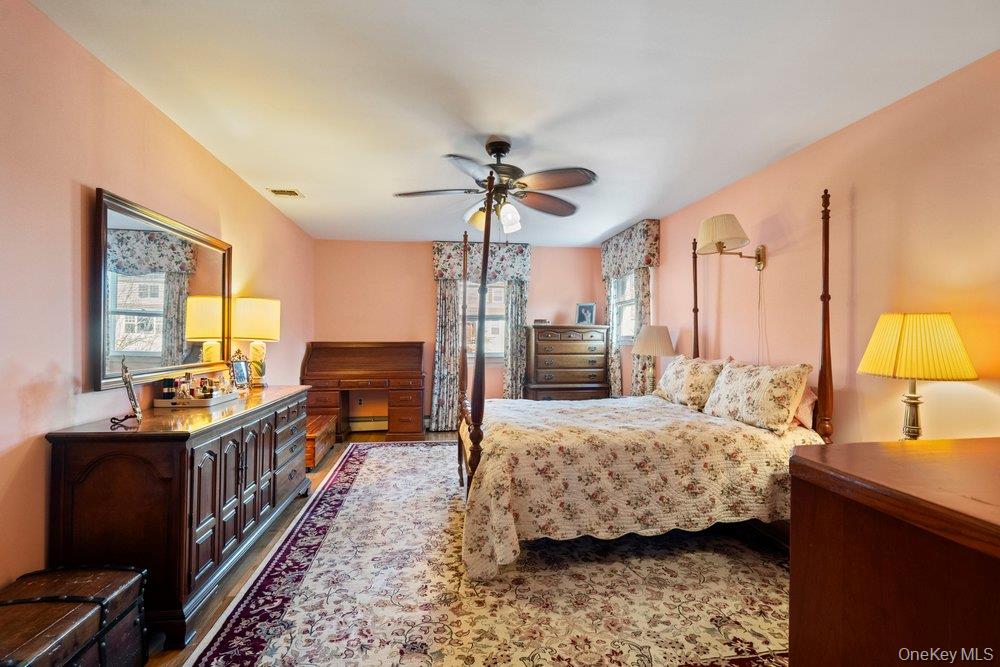 18 Barry Lane Syosset, NY 11791 - Photo 27 of 37 a bedroom with furniture and a large window