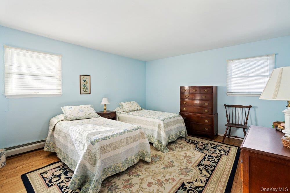 18 Barry Lane Syosset, NY 11791 - Photo 31 of 37 a bedroom with two beds and a dresser