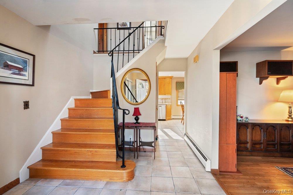 18 Barry Lane Syosset, NY 11791 - Photo 5 of 37 a view of entryway and hall with wooden floor