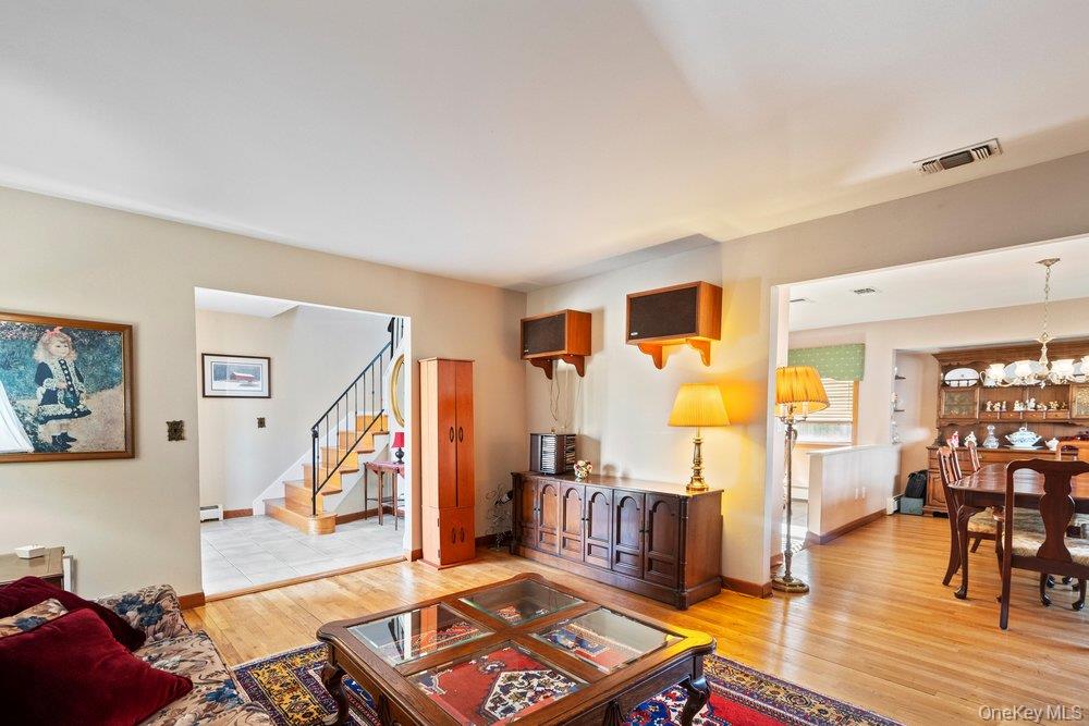 18 Barry Lane Syosset, NY 11791 - Photo 9 of 37 a living room with furniture and wooden floor