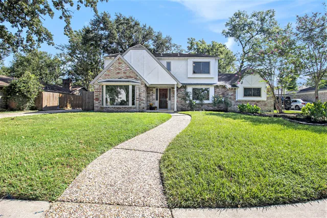 a house view with a garden space