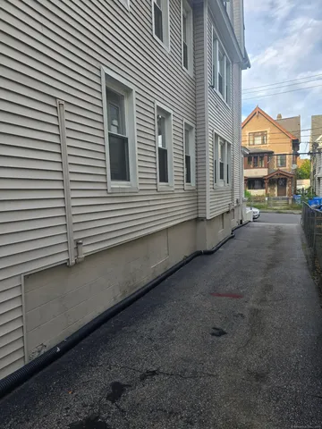 a view of a street in front of a house
