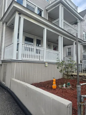 front view of a house with a fence
