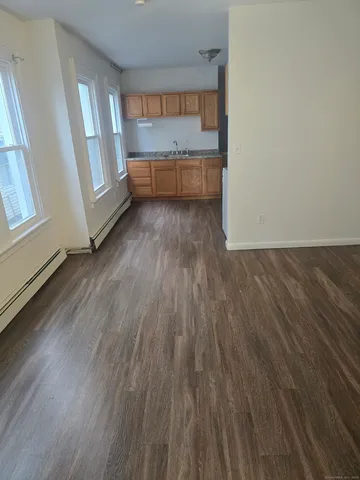 a view of entryway with wooden floor