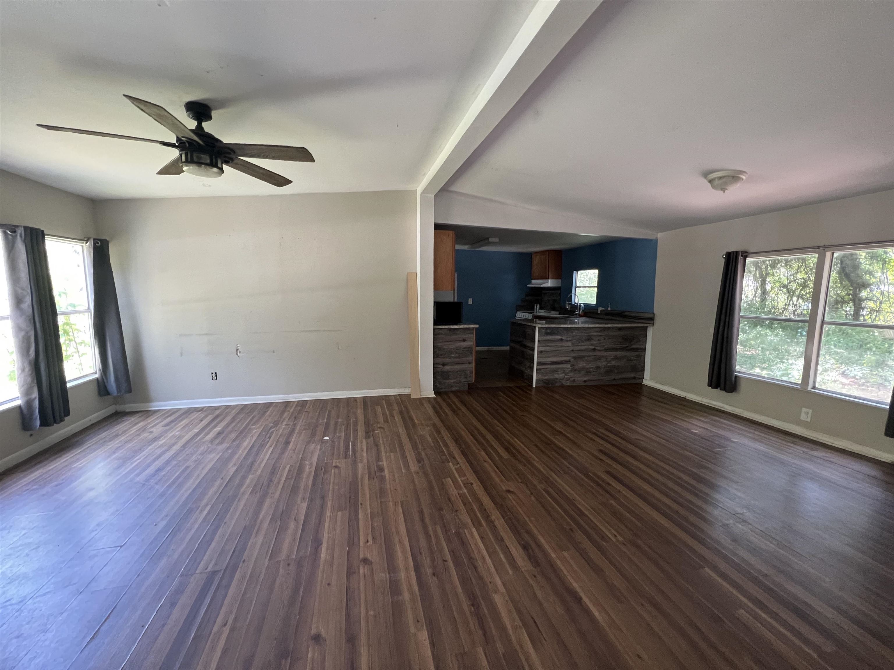 6473 Capri Isle St. Augustine, FL 32095 - Photo 2 of 7 wooden floor in an empty room with a window