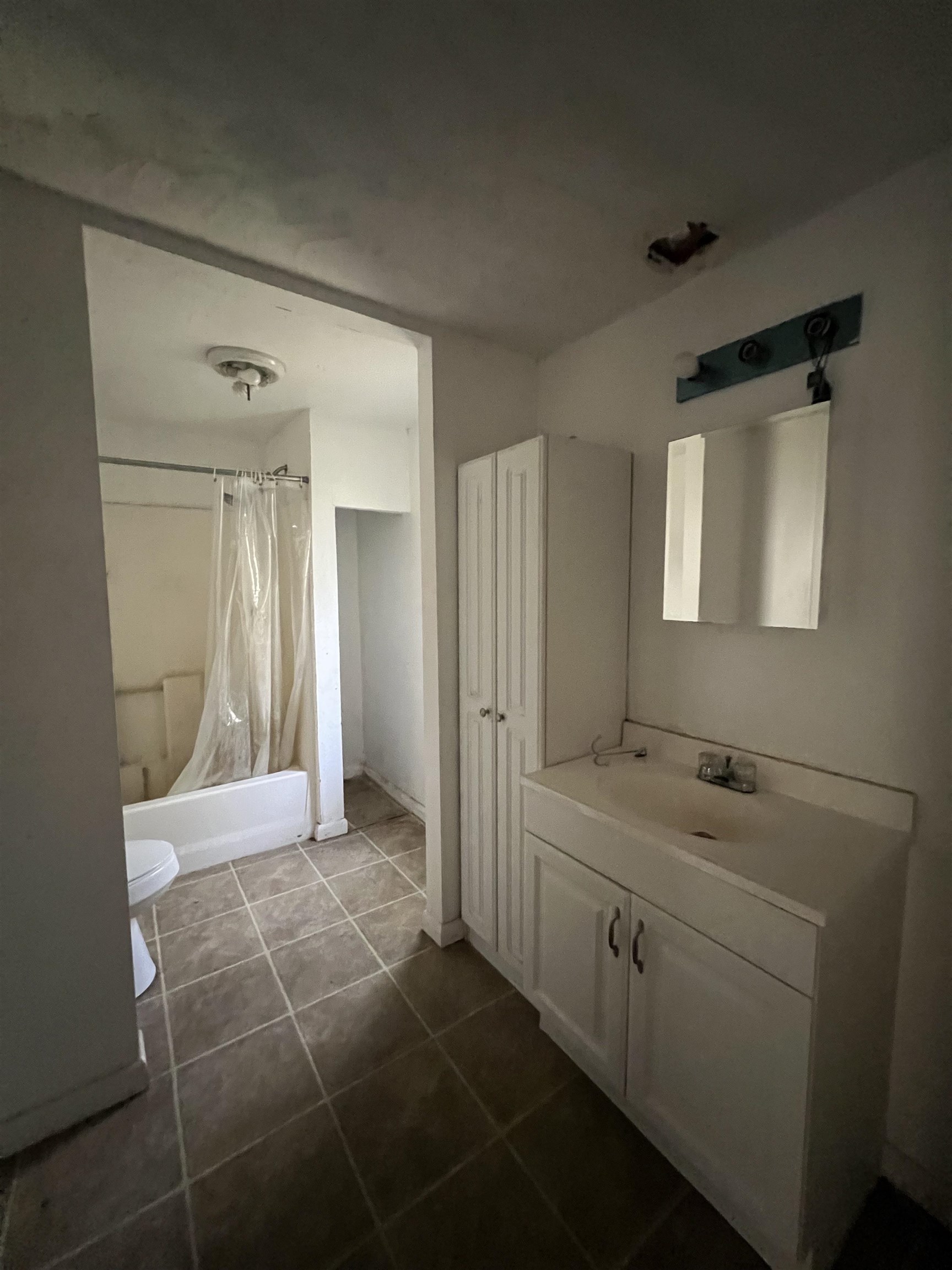 6473 Capri Isle St. Augustine, FL 32095 - Photo 6 of 7 a bathroom with a sink a toilet and mirror