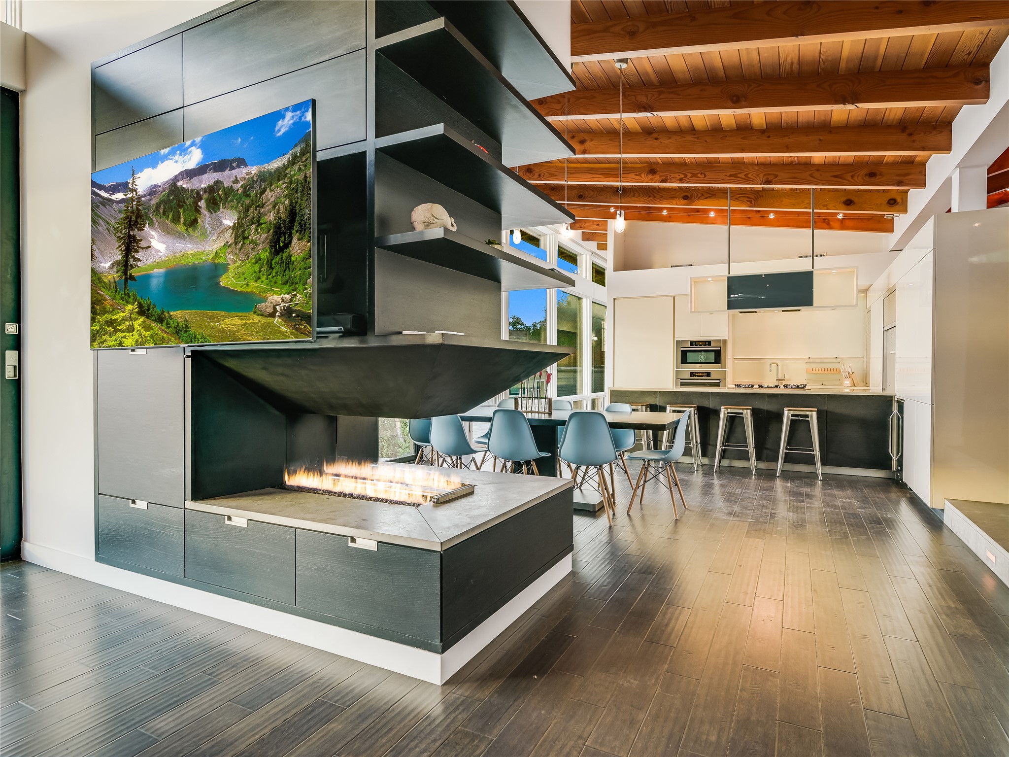 1500 Buffalo Gap Road Austin, TX 78734 - Photo 13 of 38 a living room with stainless steel appliances kitchen island granite countertop a table chairs and a wooden floor