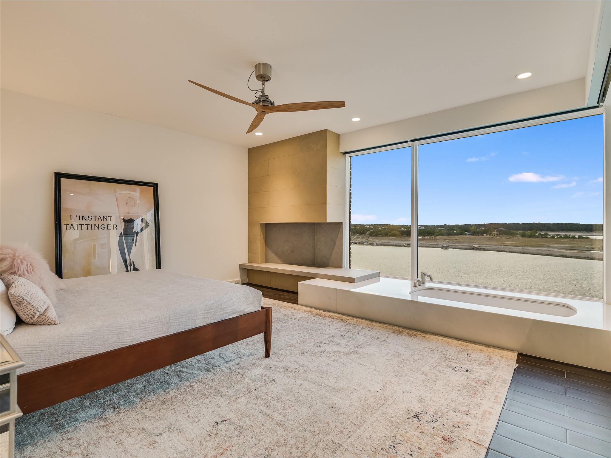 1500 Buffalo Gap Road Austin, TX 78734 - Photo 16 of 38 a spacious bedroom with a bed and wooden floor