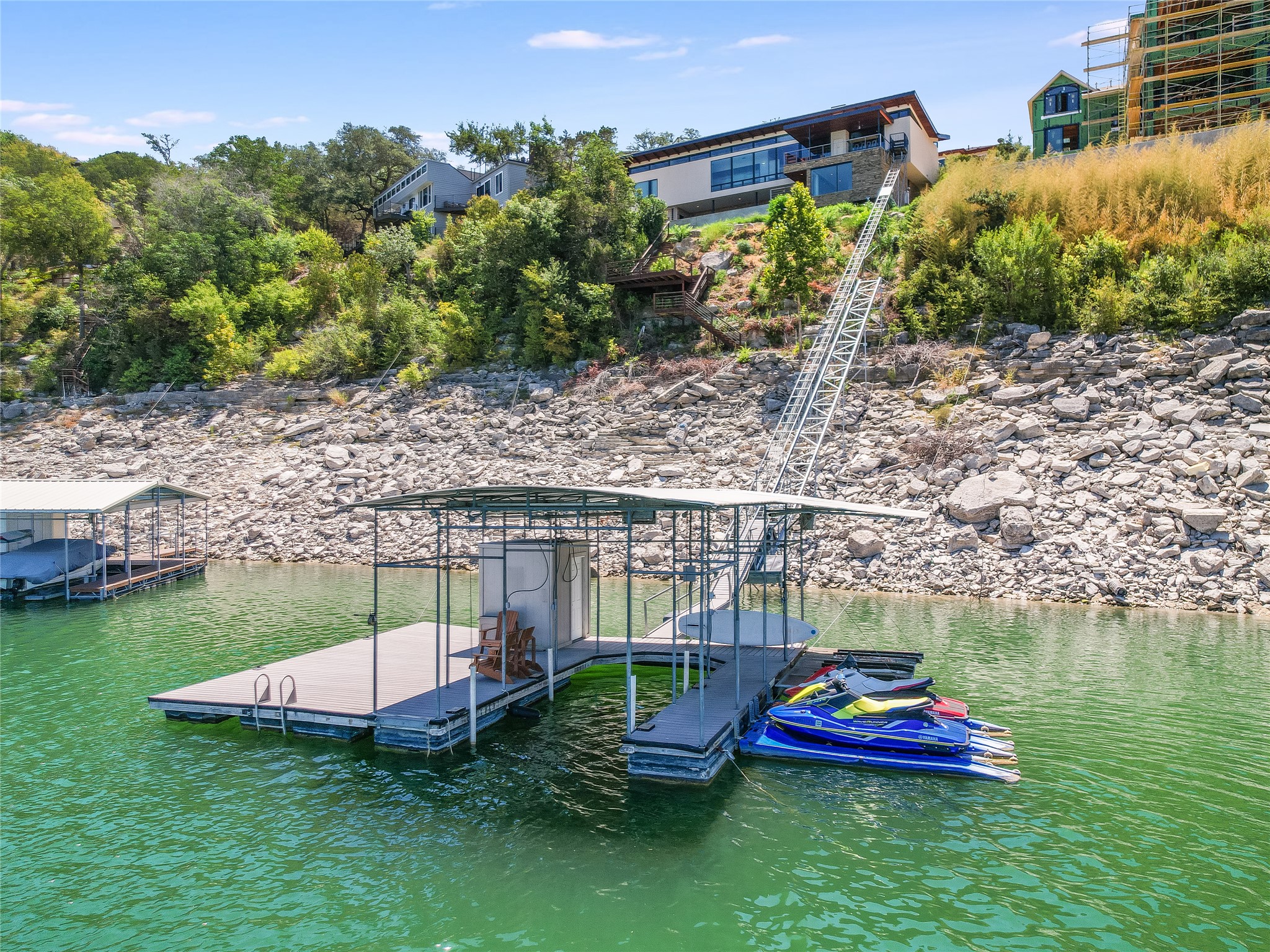 1500 Buffalo Gap Road Austin, TX 78734 - Photo 38 of 38 a view of a lake with a bench and trees