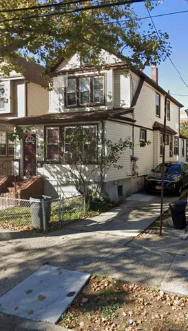 a front view of a house with street