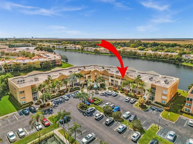 an aerial view of a house with a lake view